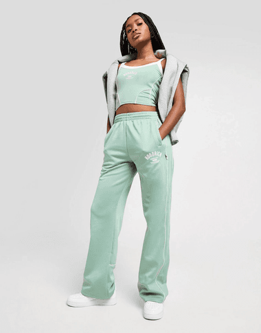 Hoodrich white crop top and black trousers